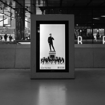 A framed screen showing the work in a station hall