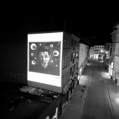 The work projected onto a building at night