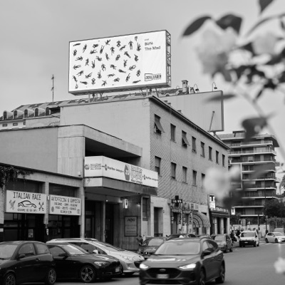 A billboard of the work above a street